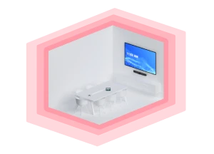 A slightly angled, eye-level view of a small, modern meeting room enclosed within a stylized pink border. The room has white walls and contains a rectangular white table surrounded by translucent white chairs. A large flat-screen television is mounted on the far wall, displaying a blue screen with white text that reads "11:58 AM". Below the television, a sleek black soundbar is visible. The room appears clean and minimalist, designed for group meetings or video conferences.