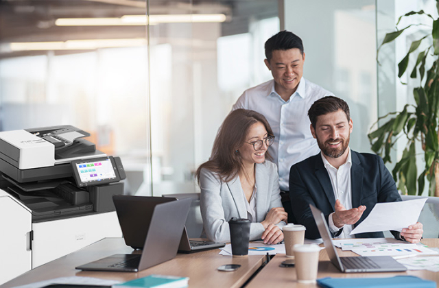 Office Print - people in office around table with printer in the background