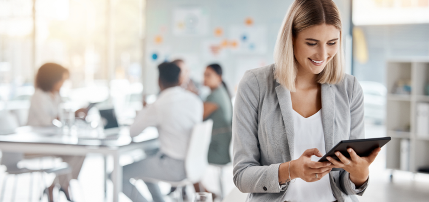 A woman looking at a tablet